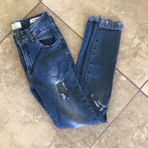 Mid Rise Distressed Skinny Jeans